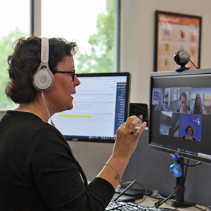 Presenter providing online guidance to conference participants